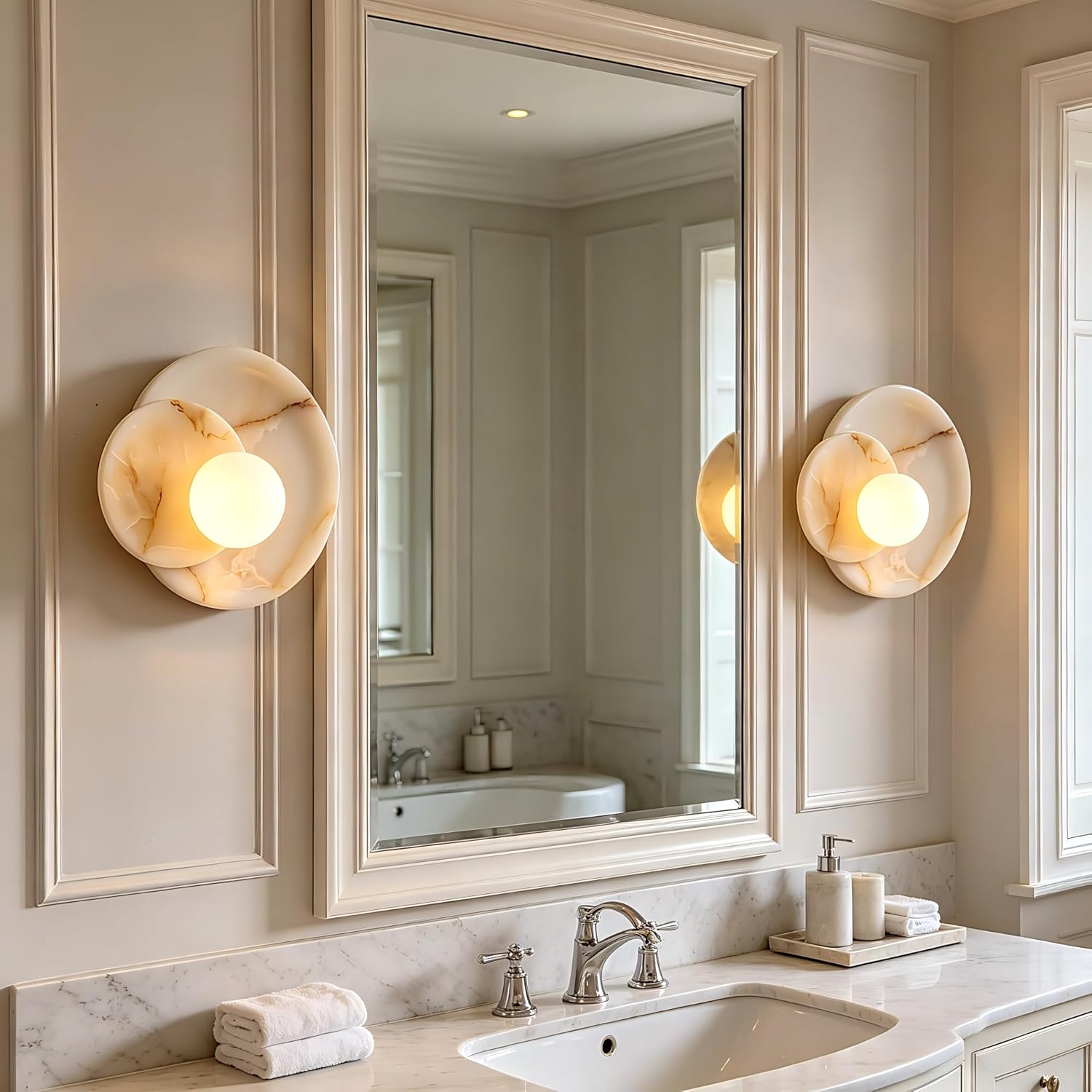 Bathroom vanity with mirror, lights, and toiletries