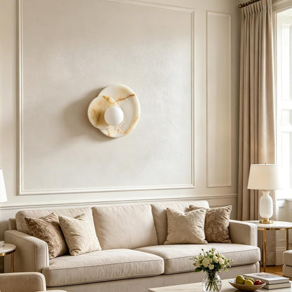 Living room with beige sofa, decorative pillows, and wall art.