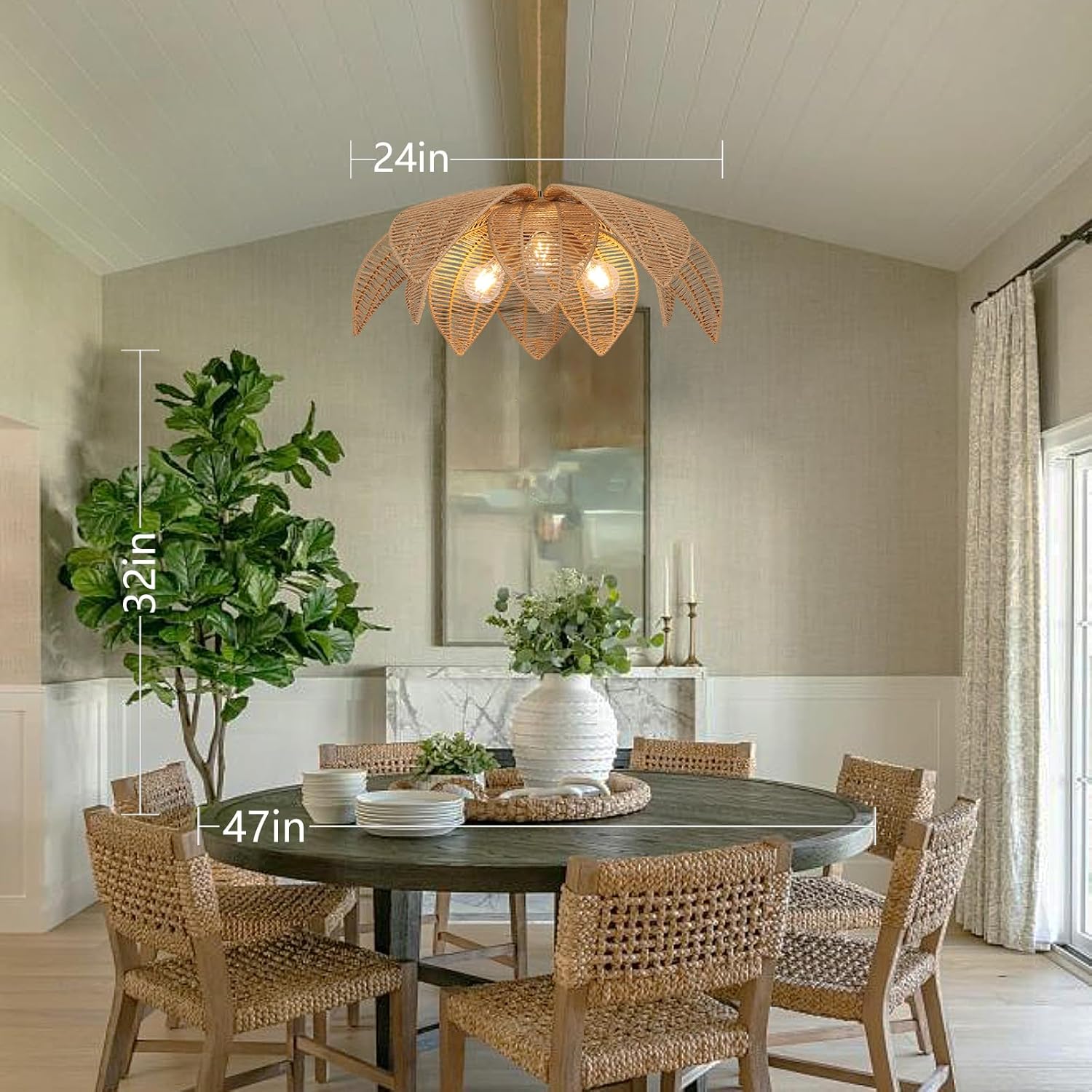 Dining room with a round table and chairs, featuring a decorative light fixture.