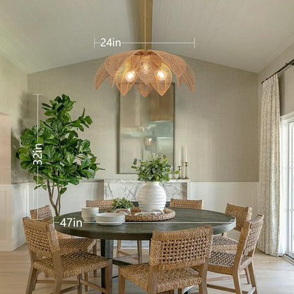 Dining room with a round table and chairs, featuring a decorative light fixture.