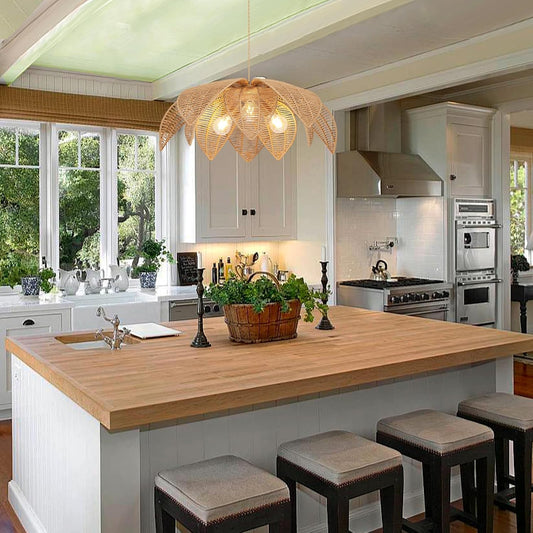 Modern kitchen with wooden island, stools, and decorative elements.