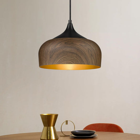 Wooden pendant light with gold interior on a neutral background