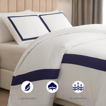 White comforter with navy blue stripes on a bed, featuring icons and text indicating lightweight, soft, and breathable qualities.