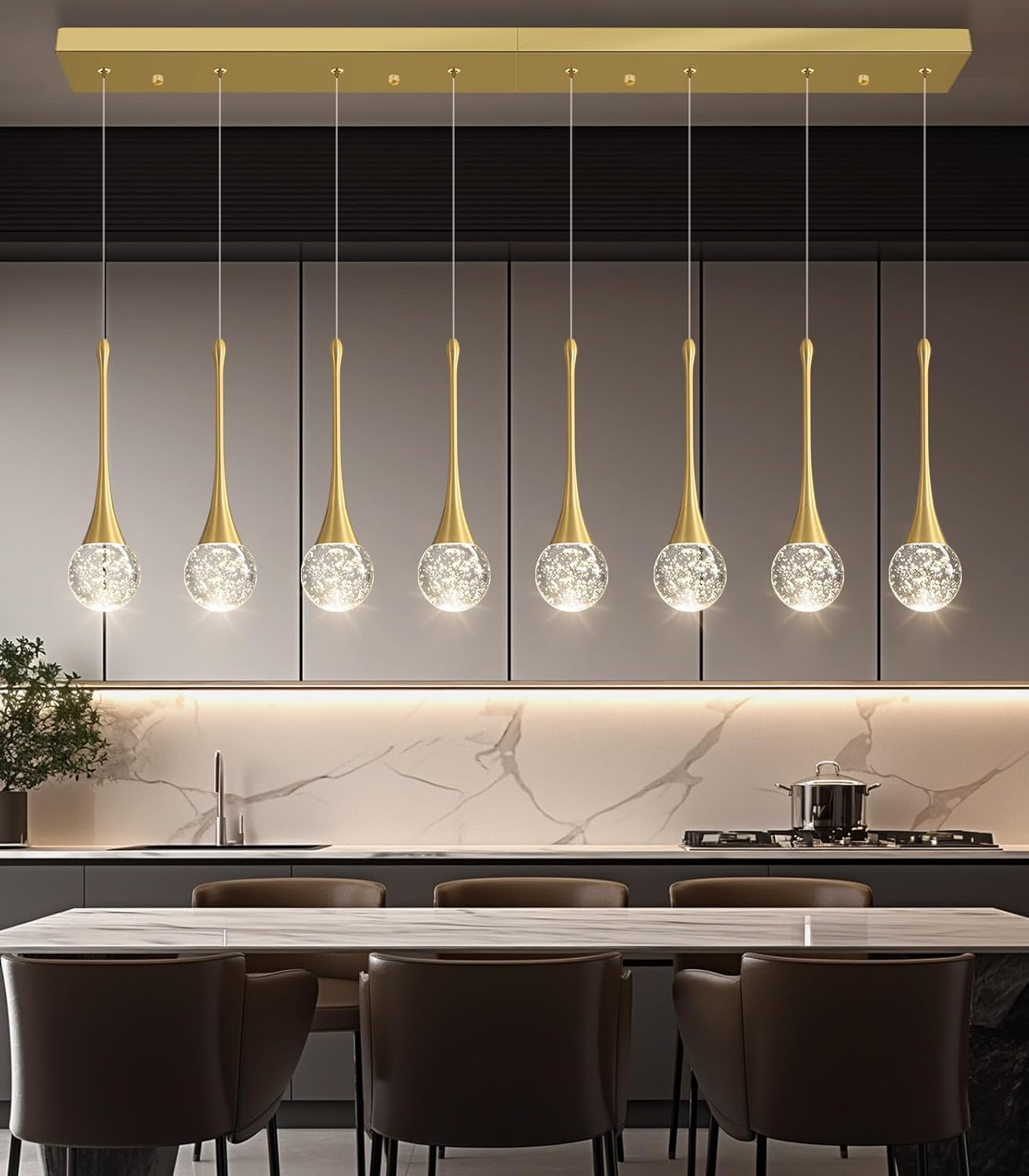 Modern kitchen with pendant lights hanging above a dining table.