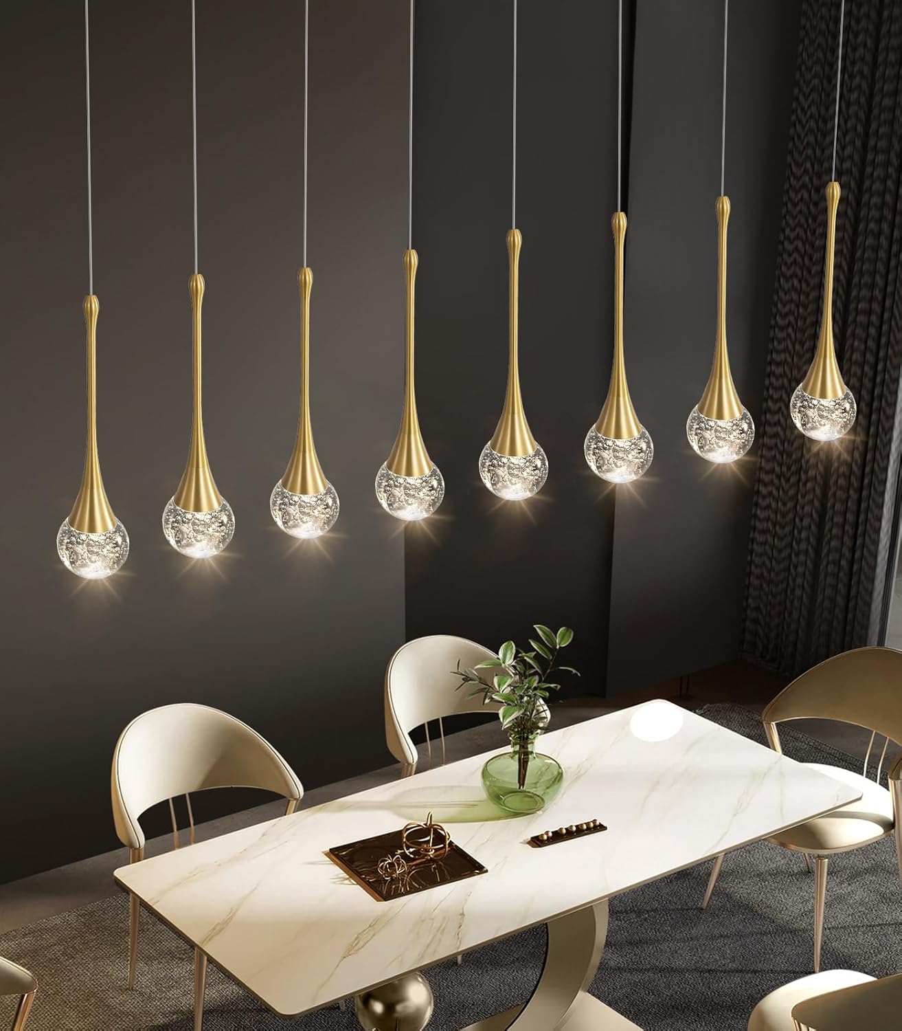 Modern dining room with gold pendant lights and a marble table.