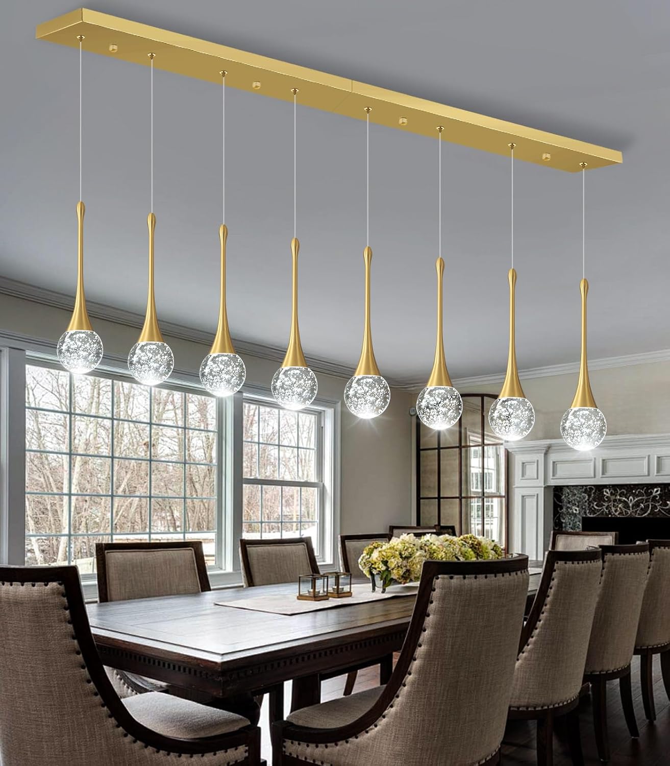 Dining room with a modern pendant light fixture above a table.