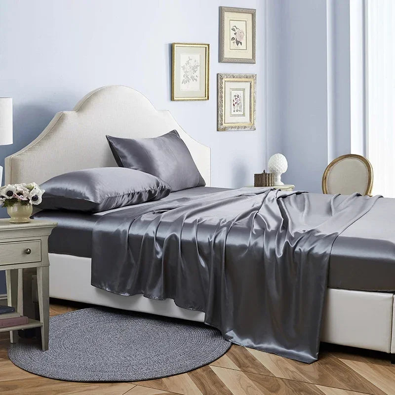 An opulent bed featuring a gray satin sheet, epitomizing the sophistication of the Opulent Satin Bed Sheet Set.