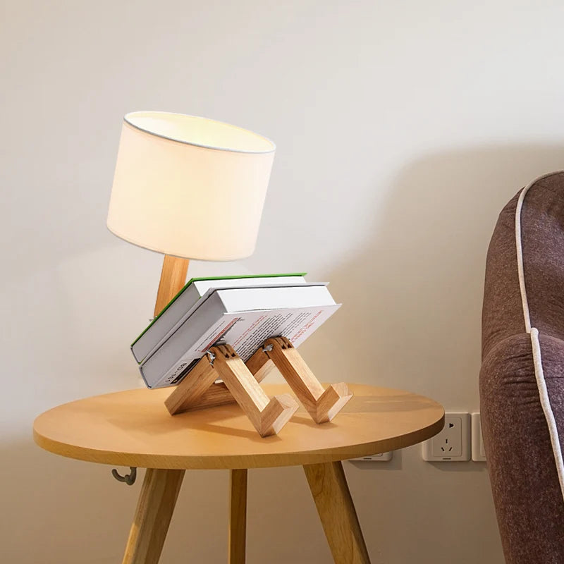 A creative wooden reading lamp with books resting on it.