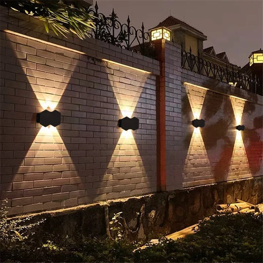 The Trilight Glow LED Wall Sconce casts a radiant glow on the outdoor wall with its double lights.