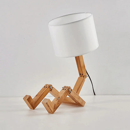 Wooden reading lamp featuring a book, a perfect combination for book lovers.