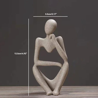 "The Thinker Statue Tabletop Art" showcases a statue of a woman sitting contemplatively on a table.