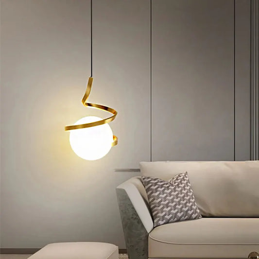 A contemporary radiant pendant light in gold and white colors.