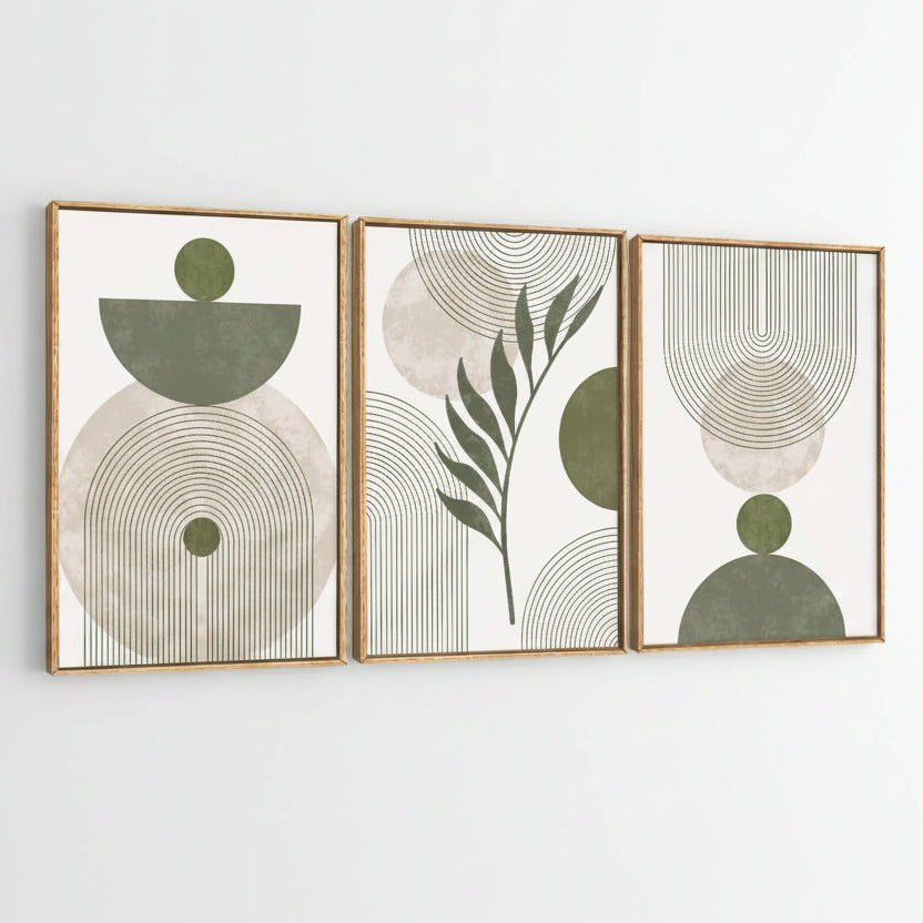 Three framed abstract botanical wall art prints with gold-toned frames, featuring sage green and beige geometric shapes and leaf motifs on a white background.
