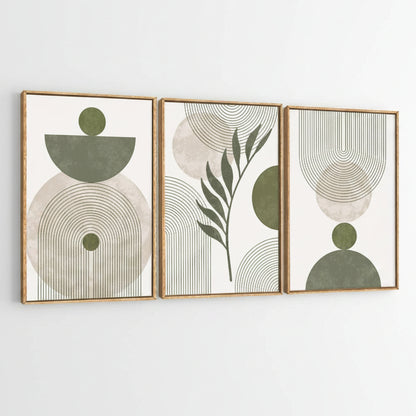 Three framed abstract botanical wall art prints with gold-toned frames, featuring sage green and beige geometric shapes and leaf motifs on a white background.
