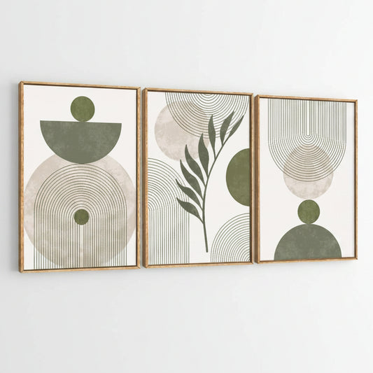Three framed abstract botanical wall art prints with gold-toned frames, featuring sage green and beige geometric shapes and leaf motifs on a white background.