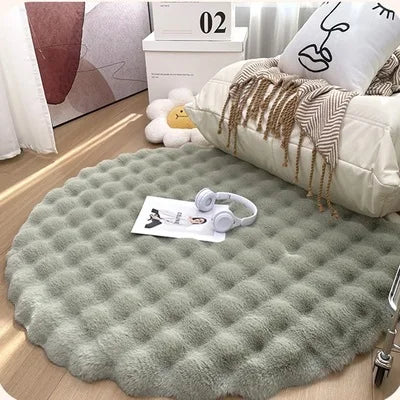 Experience ultimate comfort and a touch of winter magic with this round rug, made of light green fur resembling a snowy soft faux rabbit.