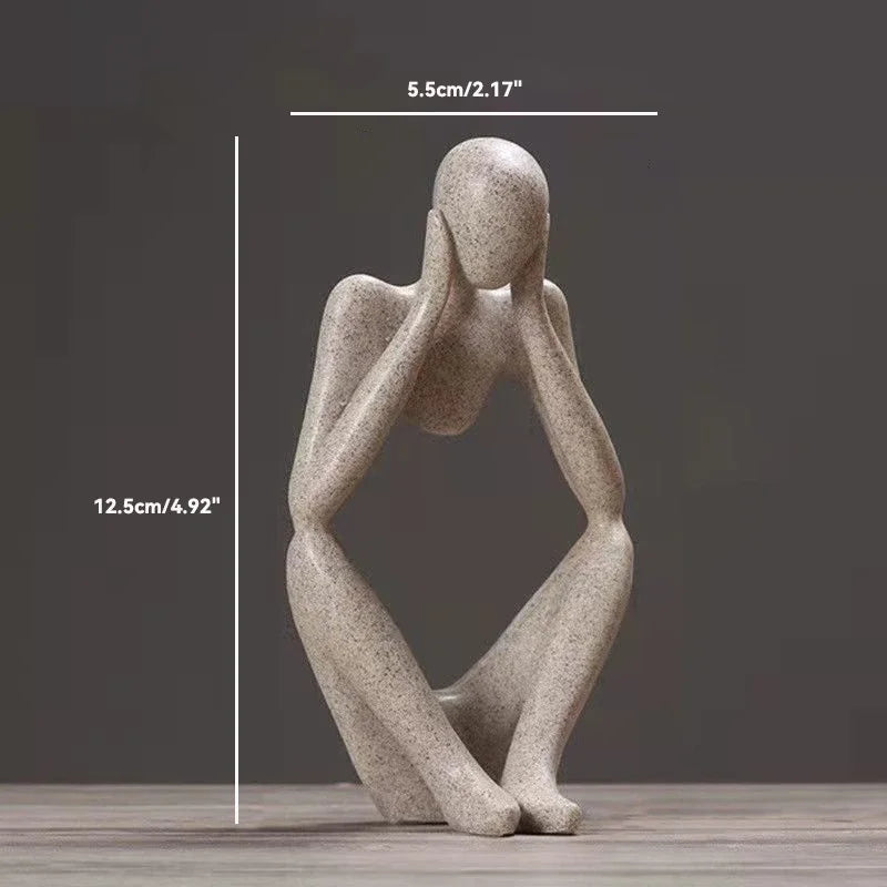 Artistic representation of a woman statue seated on a table.