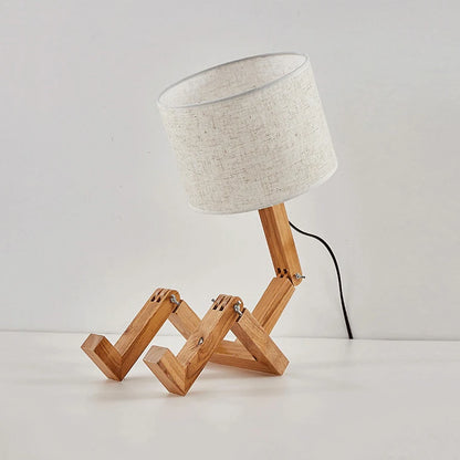 Enhance your reading experience with a wooden lamp and a book.