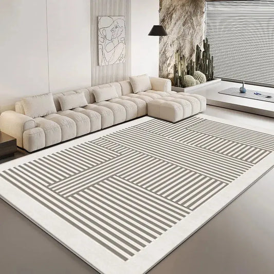 Modern living room featuring a large rug and a couch.