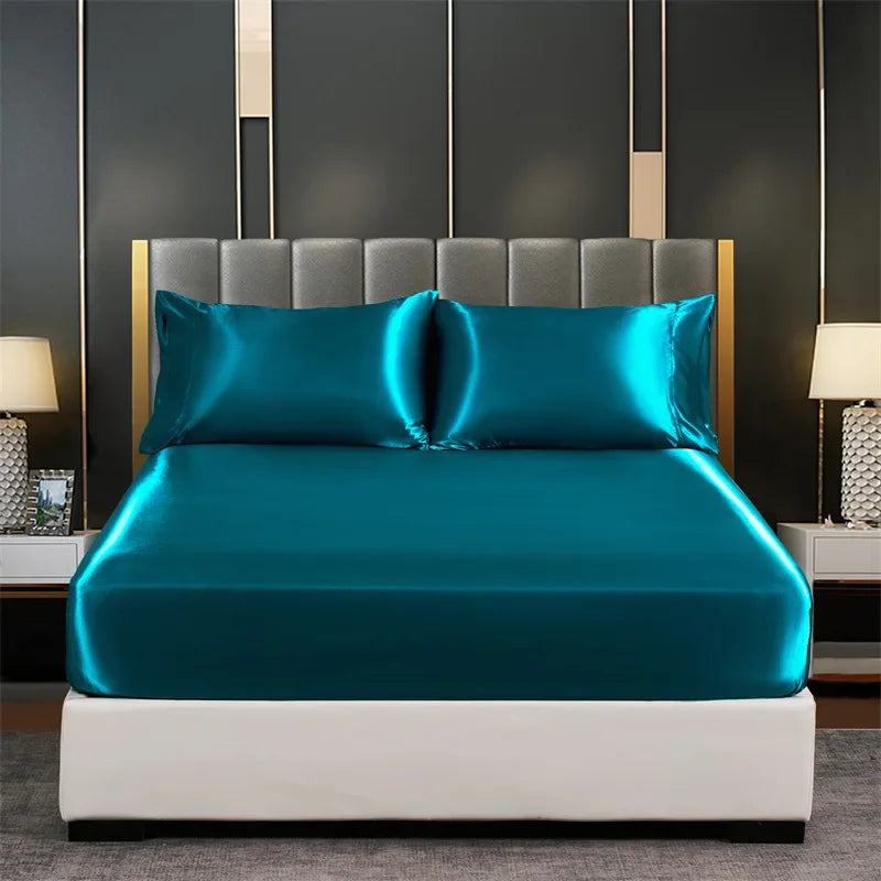 Blue satin sheet from LuxeSatin Summer Bed Sheet Set covering a cozy bed.