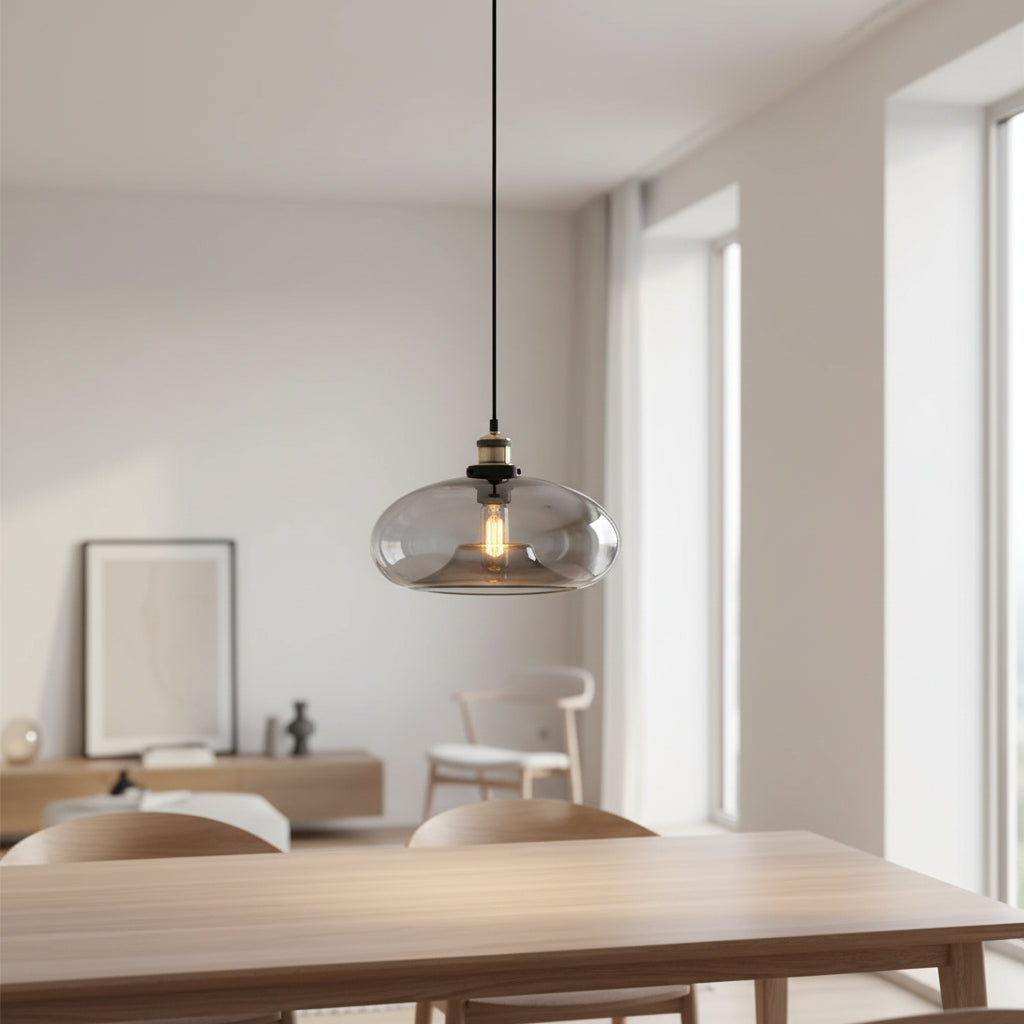Modern bedroom with a pendant light, bed, and nightstand.