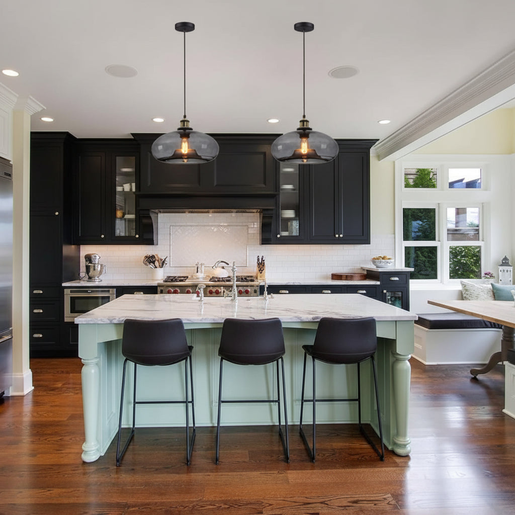 Modern kitchen with island, bar stools, and pendant lights.