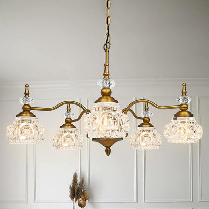 Vintage-style chandelier with crystal glass shades on a neutral background