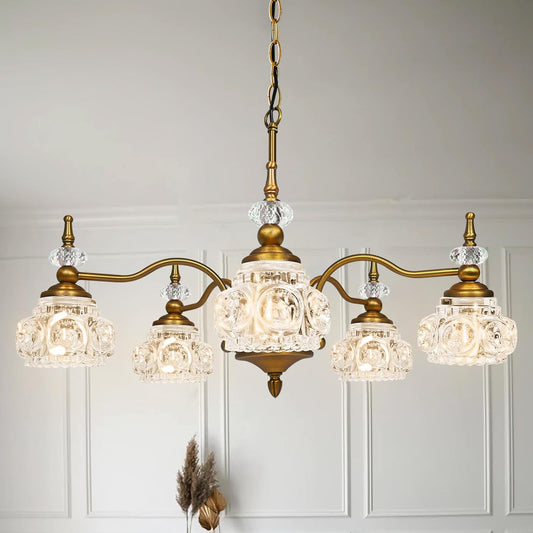 Vintage-style chandelier with crystal glass shades on a neutral background