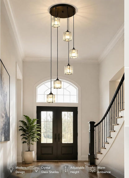 Foyer with modern pendant lights, staircase, and double doors.