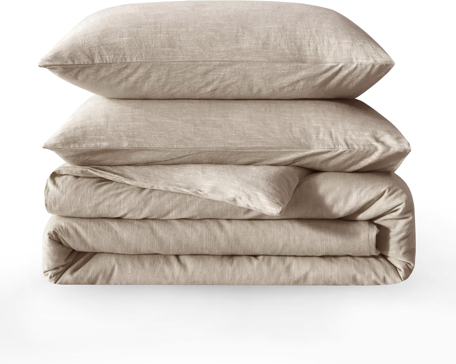Folded beige bedding set with two pillows on a white background