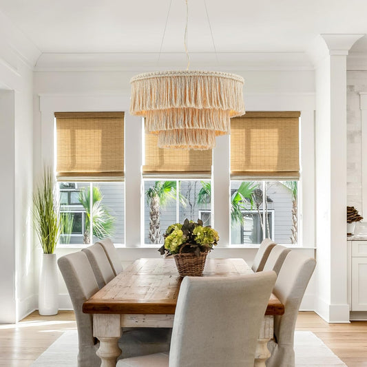 Dining room with wooden table, chairs, and a chandelier.