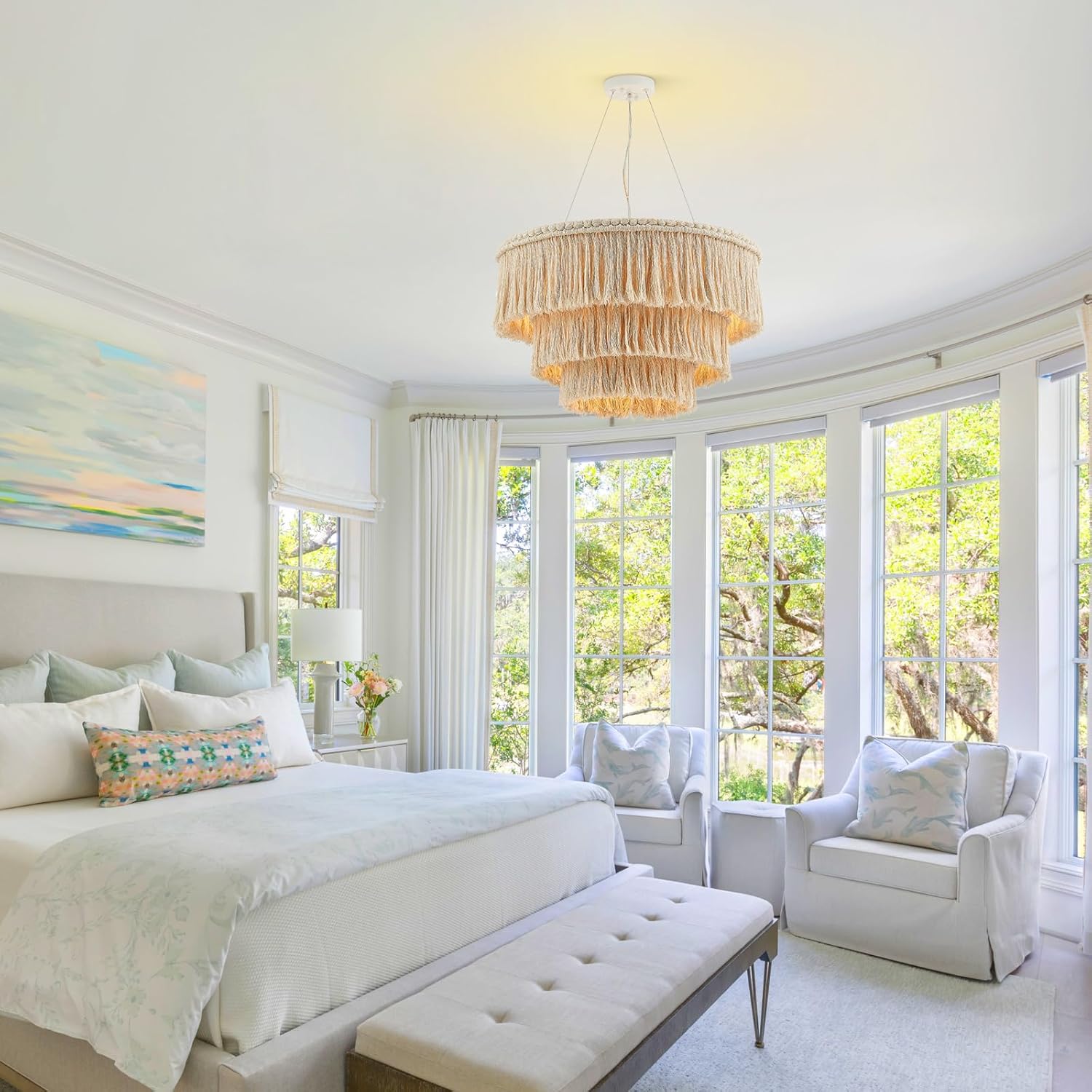 Luxurious bedroom with a chandelier, bed, and armchair.