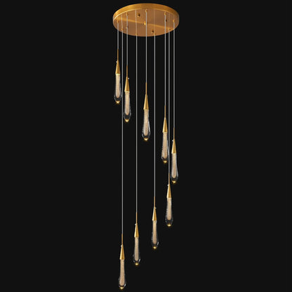 Modern chandelier with hanging glass shades on a black background