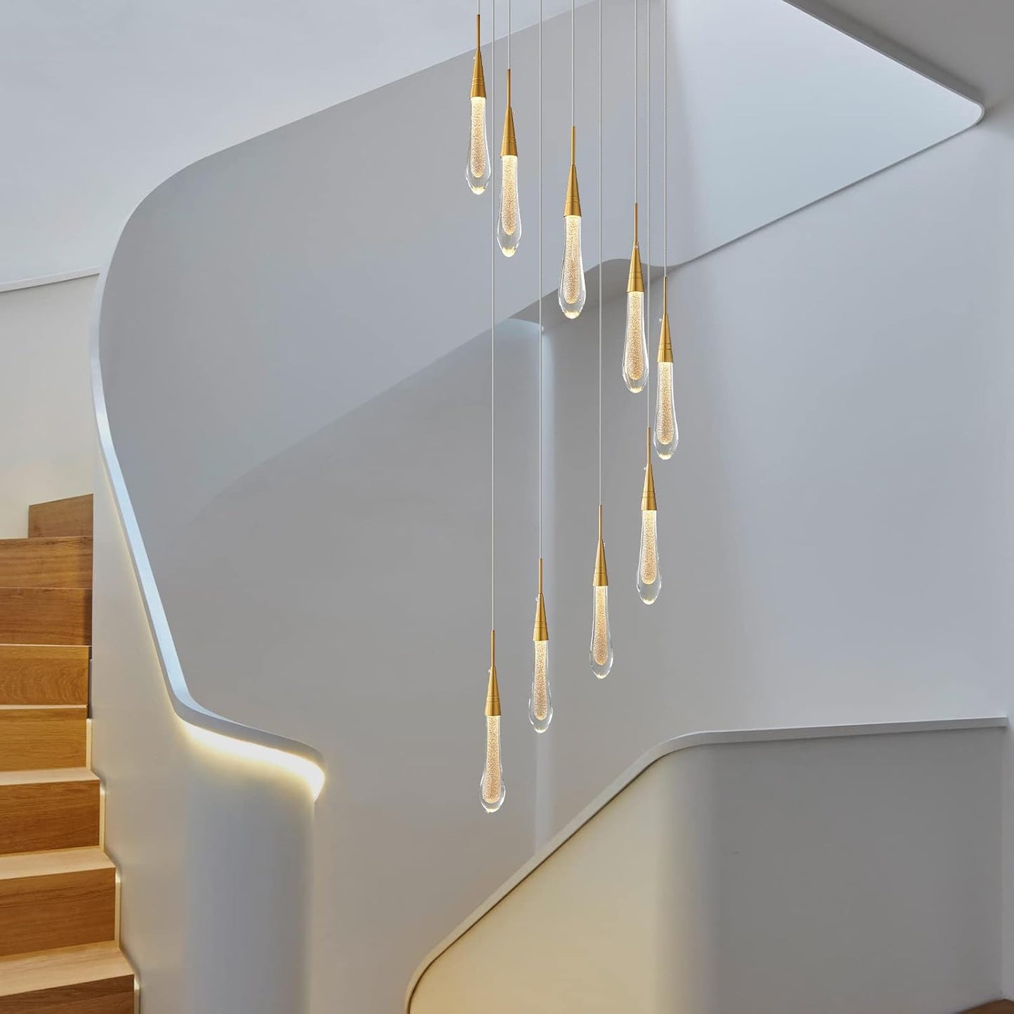Modern staircase with hanging pendant lights in a minimalistic setting