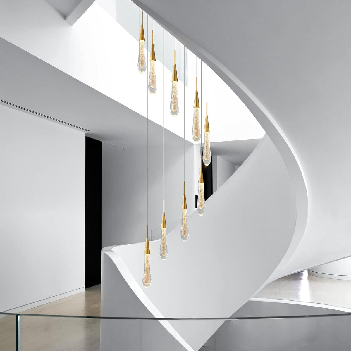 Modern staircase with gold pendant lights in a minimalistic setting