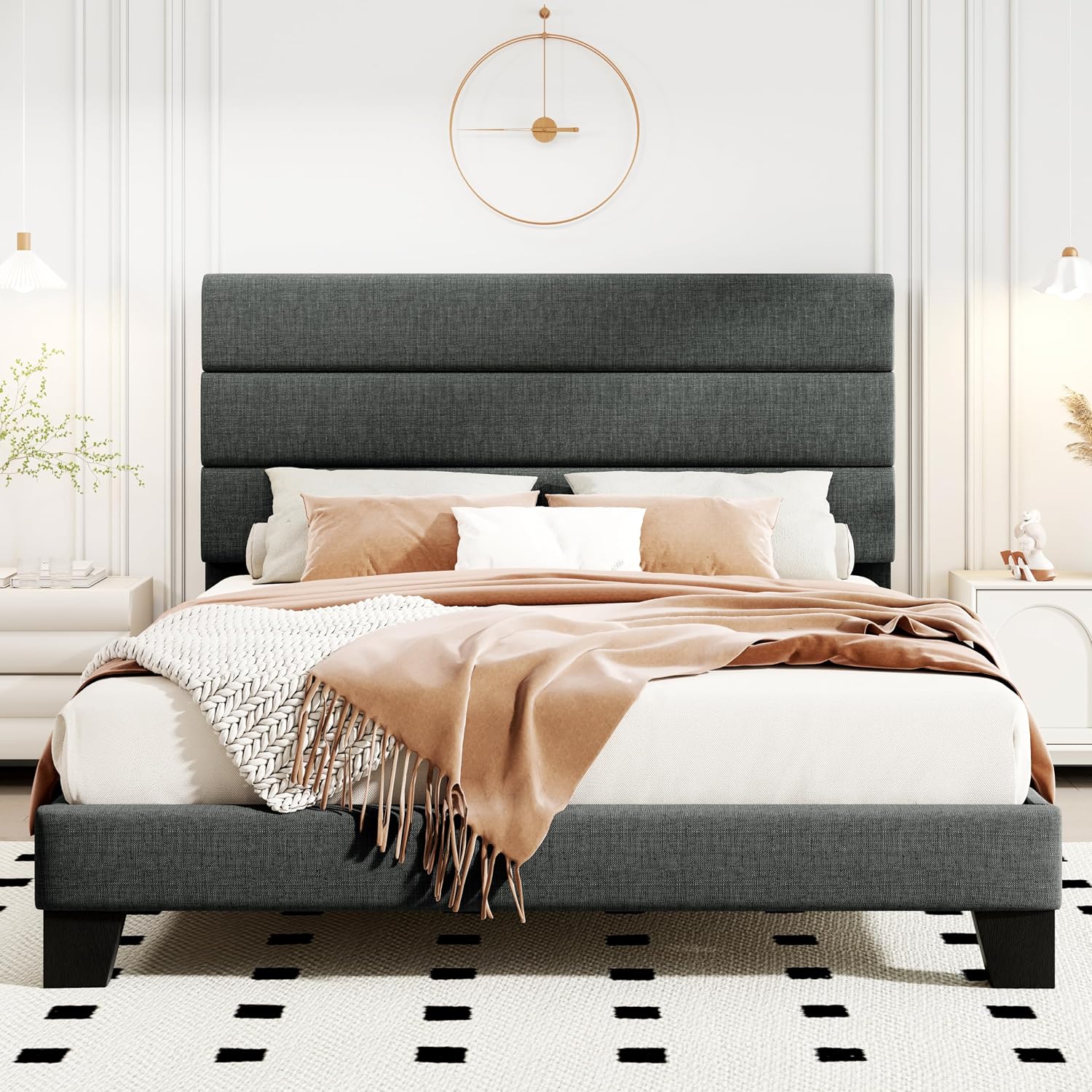 Gray upholstered bed with white bedding and a beige throw blanket in a bedroom setting.