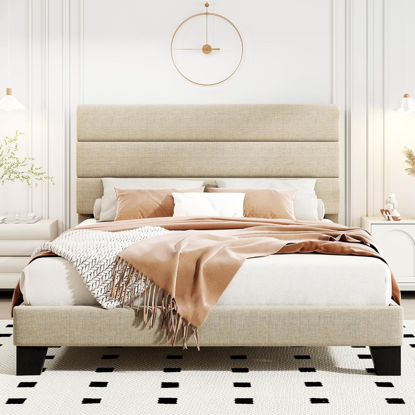 Beige upholstered bed with white bedding and brown throw blanket in a bedroom setting.