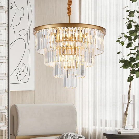Gold chandelier in a room with a sofa and plant