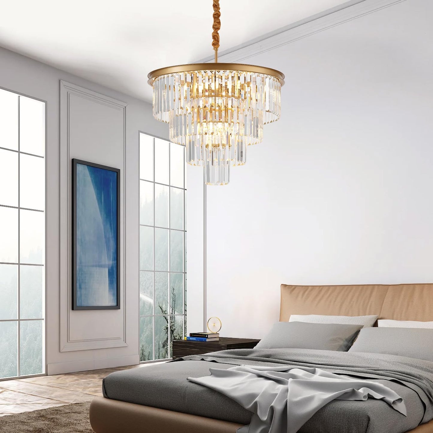 Chandelier hanging above a bed in a modern bedroom with large windows.
