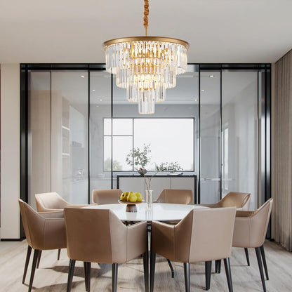 Modern dining room with a chandelier, table, and chairs.