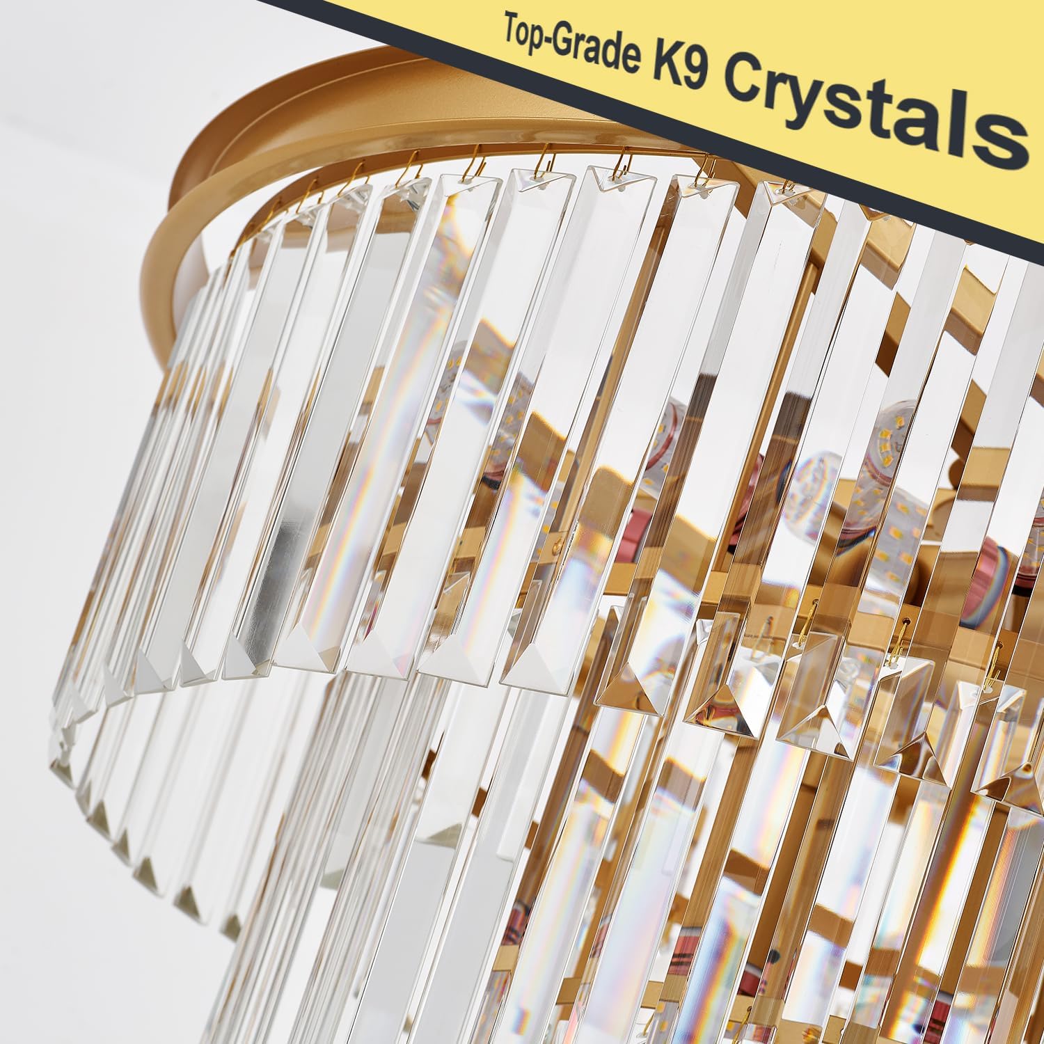 Chandelier with clear crystals and gold accents on a white background