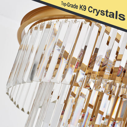Chandelier with clear crystals and gold accents on a white background