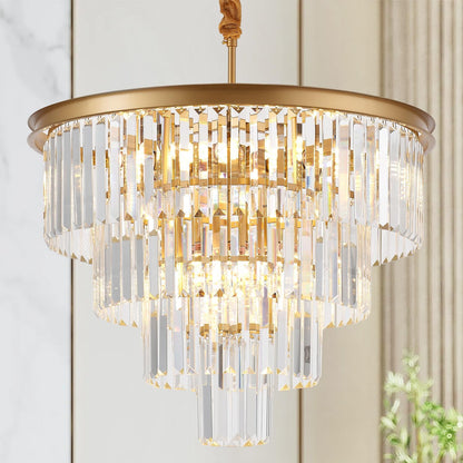 Gold and crystal chandelier hanging against a neutral wall.