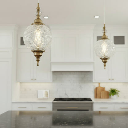 Kitchen with decorative pendant lights, white cabinets, and a counter.