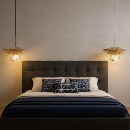 Bedroom with beige walls, a bed with white bedding, and two hanging lamps.