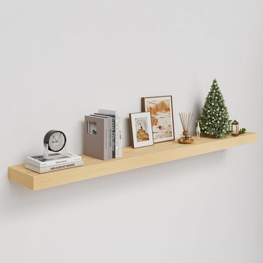 Wooden shelf with decorative items on a plain wall