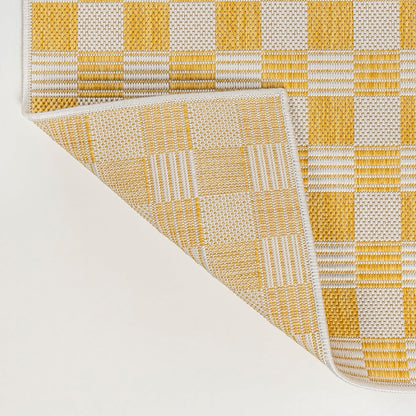 Yellow and beige checkered pattern on a textured surface