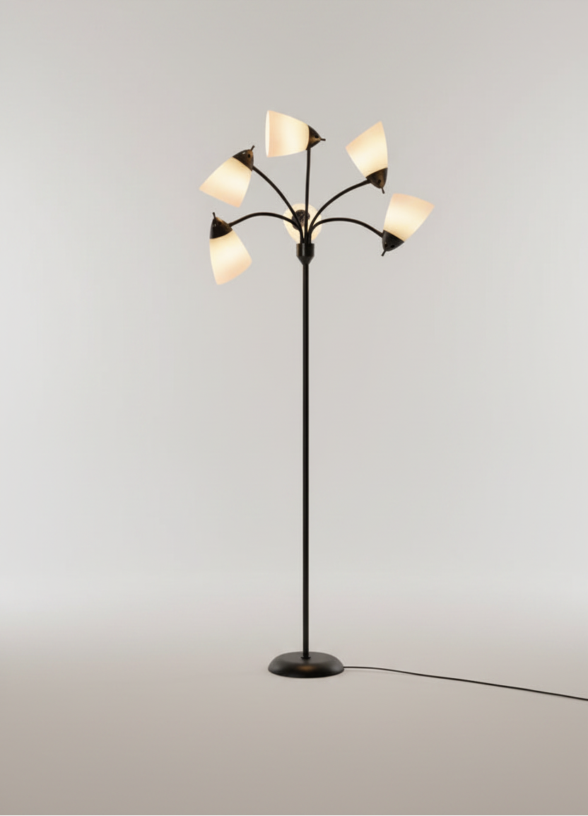 A modern multi-arm floor lamp with a black metal frame and six tapered white shades, shown illuminated against a clean light gray studio background.