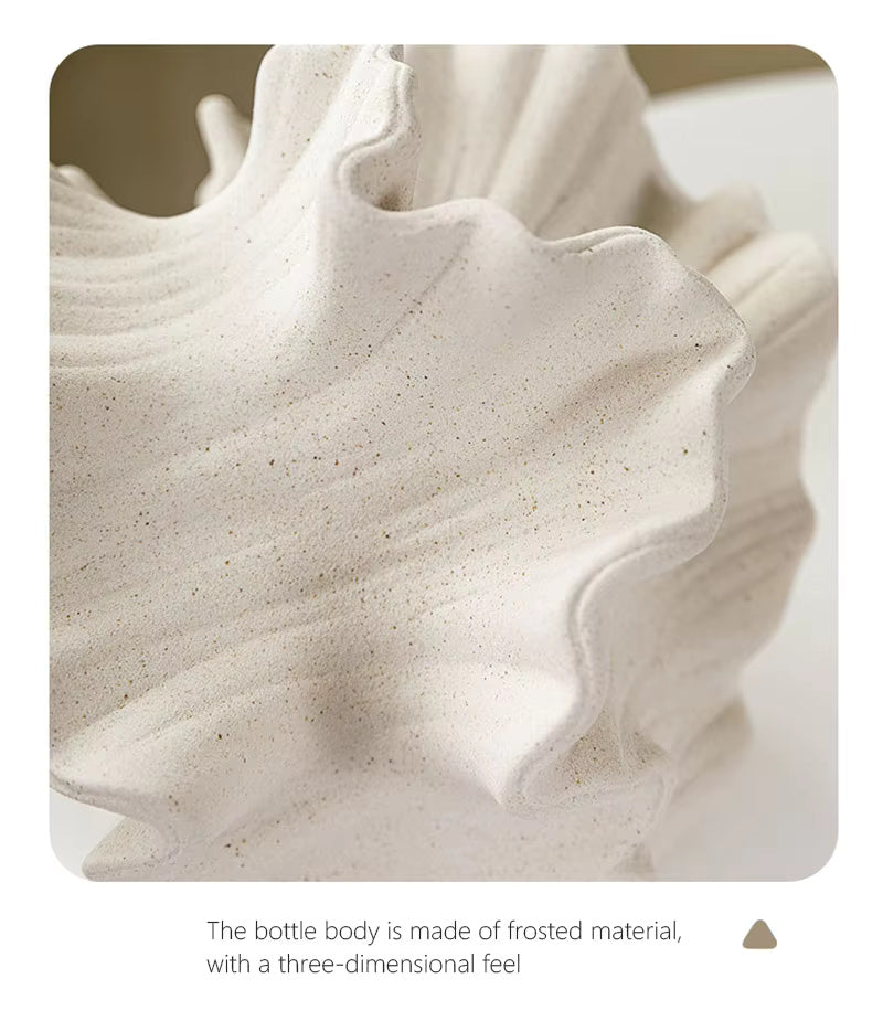 closer look of ceramic made Beige donut‑shaped ceramic vase