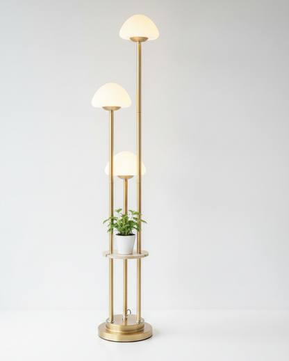 Modern floor lamp with glass shades and a plant on a white background